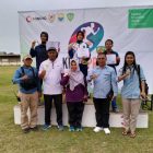 (Tengah) Salma Rafidah Peraih Medalu Emas Lari 100 Meter Putri bersama Ketua PASI Tanjab Barat Jamil Darmawan Sie, Official Santoso, Sinta dan Ketua PASI Tebo serta Kota Jambi Beserta Atlet (Humas)